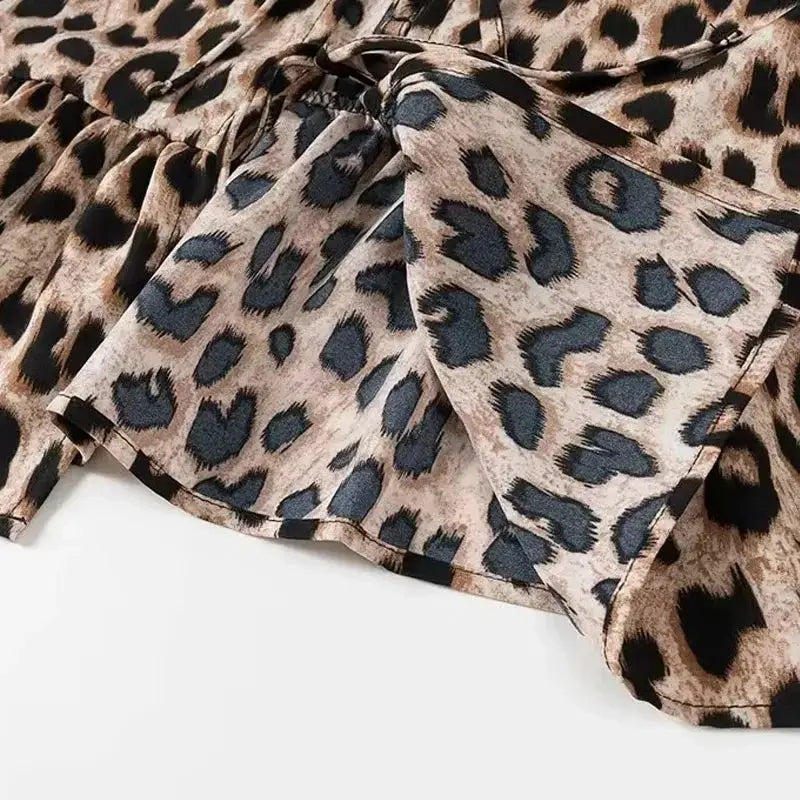 Leopard print puff sleeve blouse with tie-neck detail in beige and black