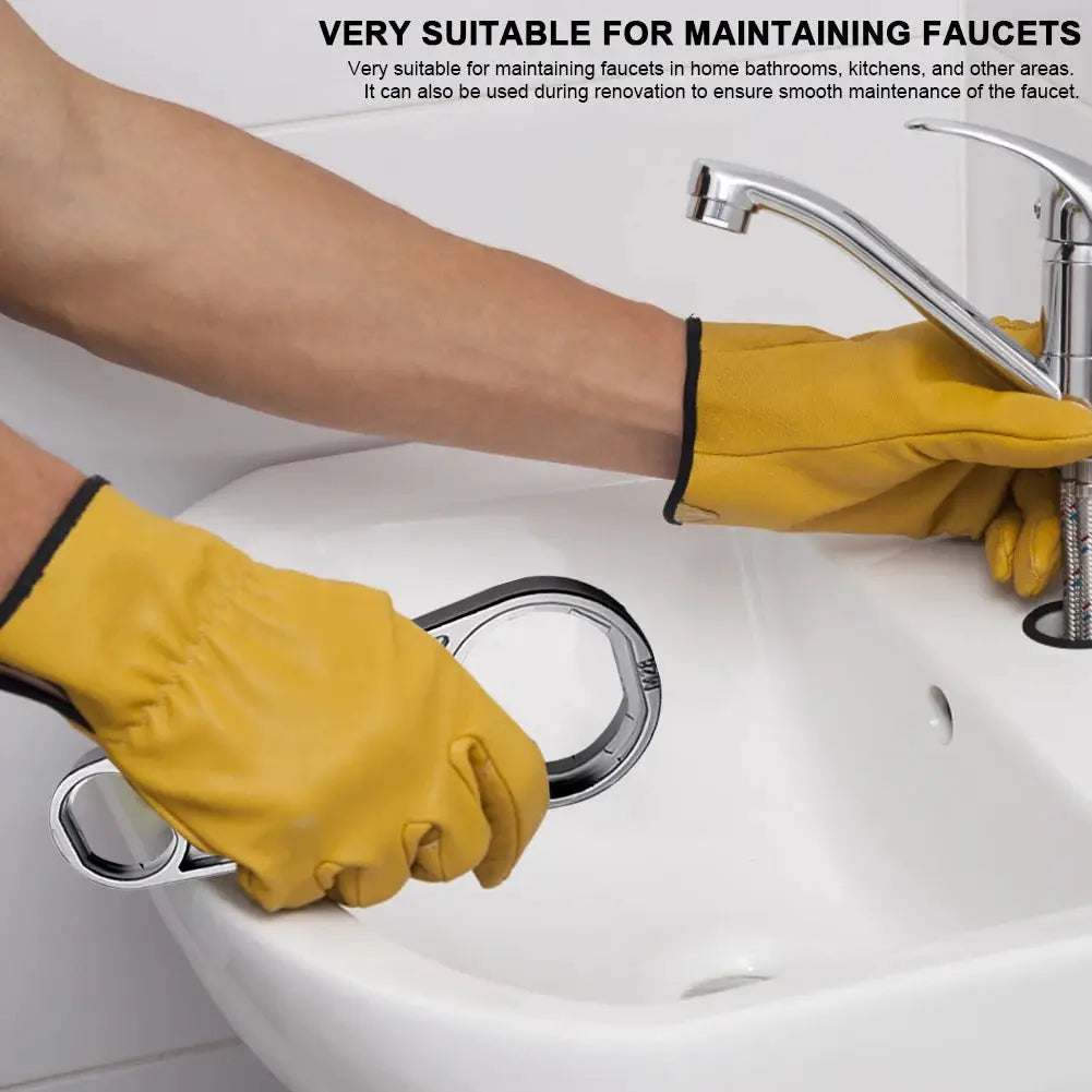 Chrome six-in-one faucet wrench tool for removing aerators, held by gloved hands at a sink.