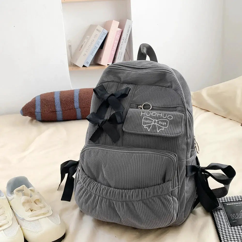 Backpack by Simples Market, gray corduroy with bow accents, 2025 Korean Ins style for commuting