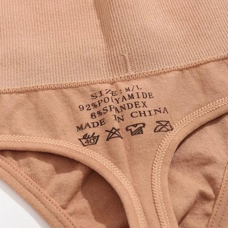 Thong underwear nude beige with size tag; 92% polyamide, 8% spandex, Made in China