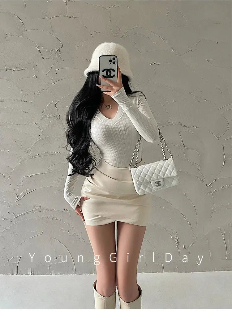 Cream PU leather mini skirt with high-waist wrap detail, Chanel-style quilted bag