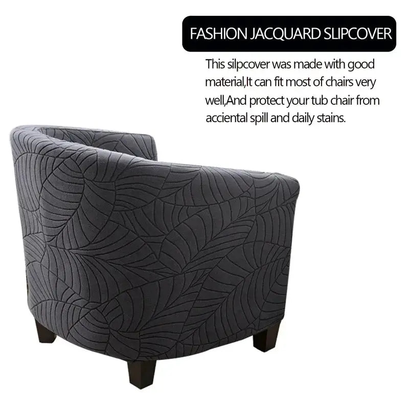 Elastic club chair cover for a single armchair in charcoal gray with a leaf jacquard pattern by Simples Market.