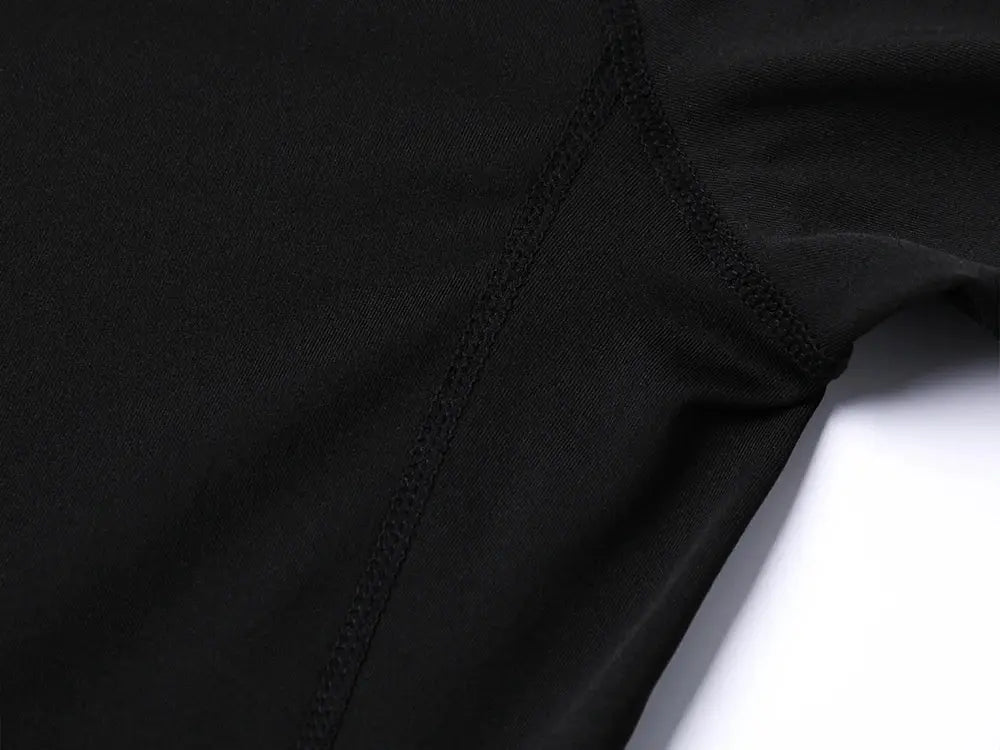 Simples Market black compression shirt set; athletic quick-dry fabric with seam detail.