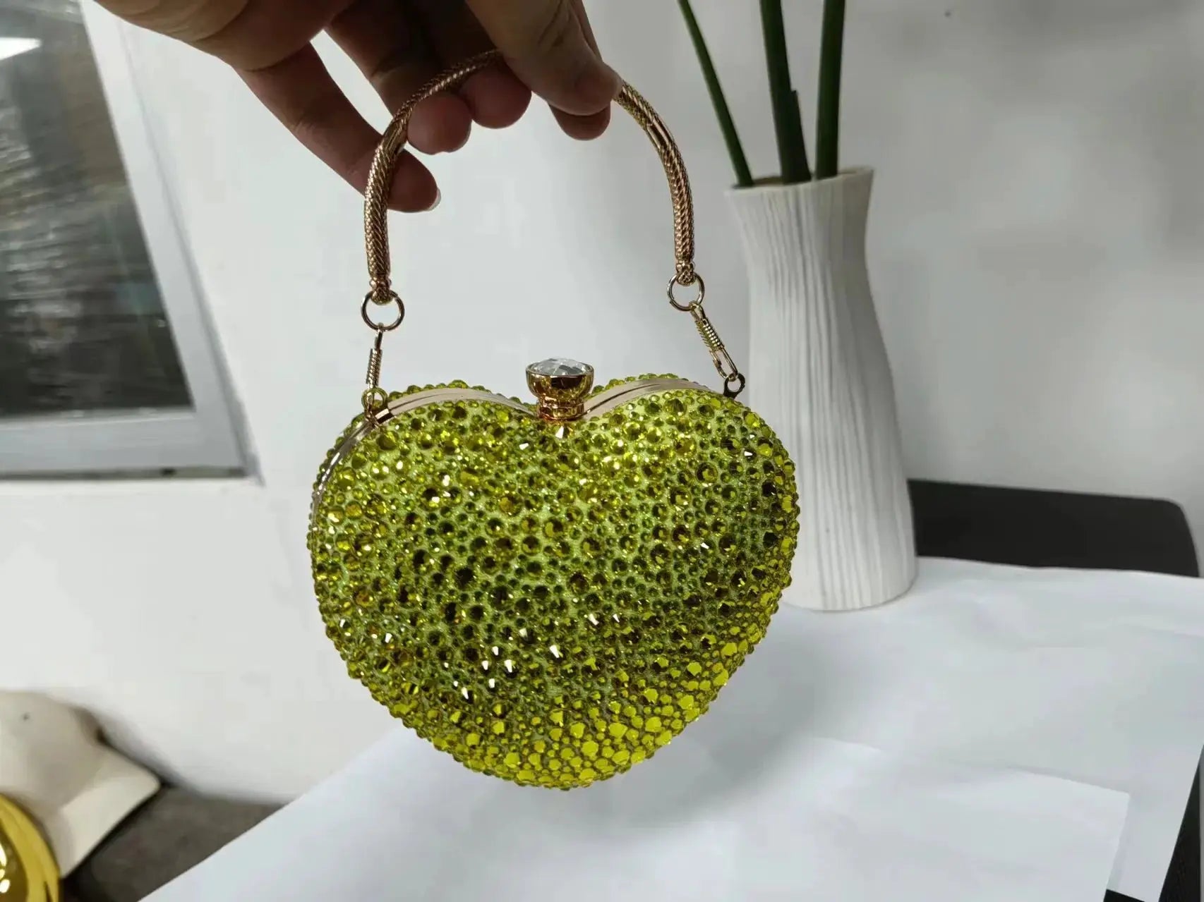 Crystal heart clutch purse by Simples Market in lime-green rhinestones with gold-tone chain handle