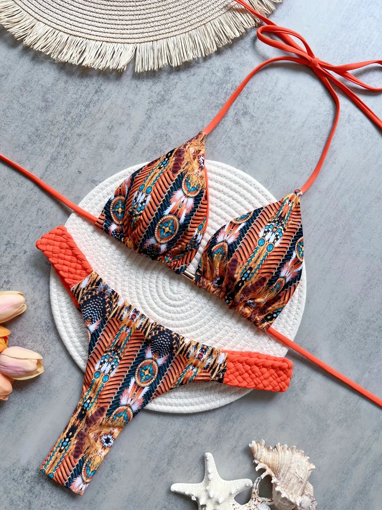 RUOTONSEPT print halter bikini set, two-piece with orange straps and high-cut thong bottoms in a bold tribal print