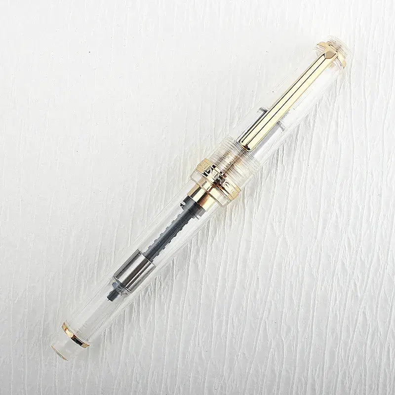 Jinhao 82 fountain pen by Simples Market, acrylic clear body with gold trim and converter