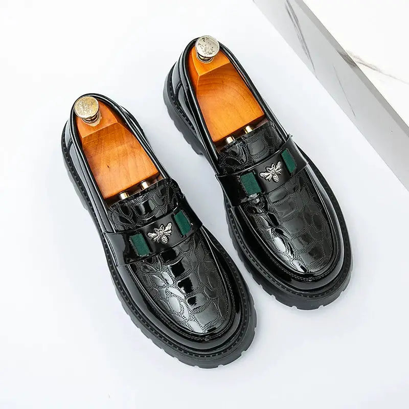 Pair of black leather loafers with bee design, thick sole, slip-on dress shoes