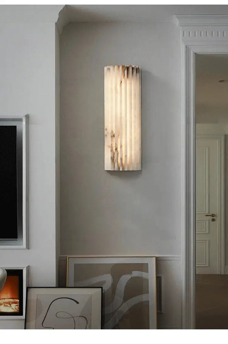 Modern Minimalist White Marble Wall Lamp by Simples Market; vertical sconce with warm light for bedroom