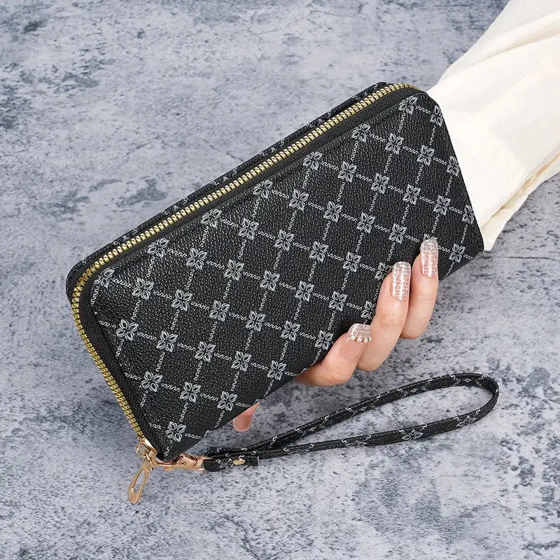Black long wallet clutch with repeating floral pattern, large-capacity, gold zipper and wrist strap