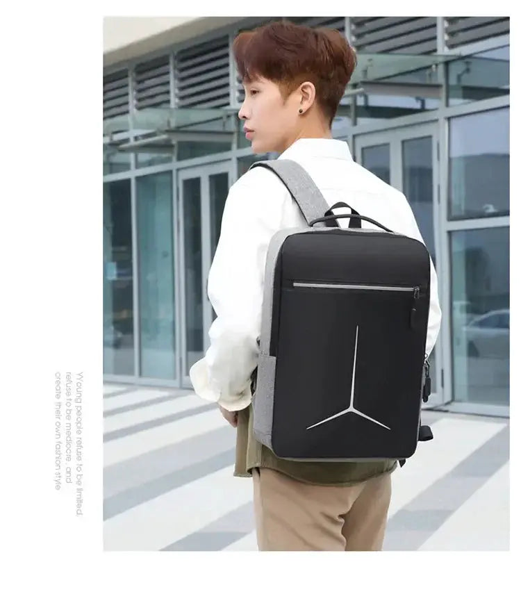 Laptop backpack with black shell and gray straps, sleek travel design