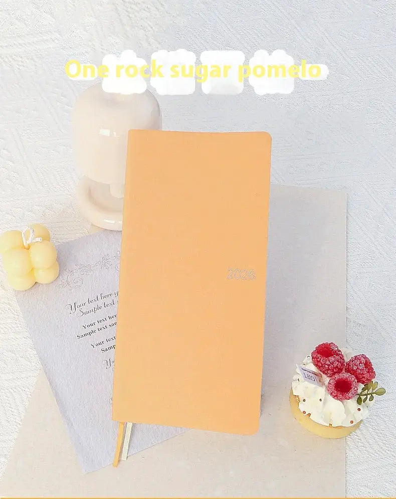 Kinbor 2026 weekly planner pocket notebook with orange cover