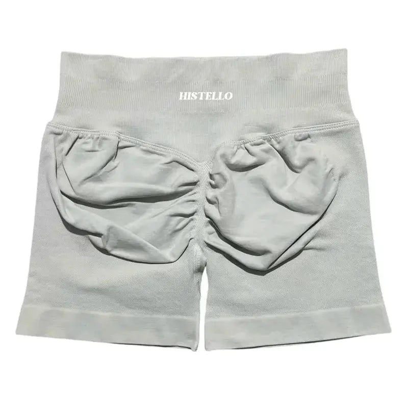 Histello women's low-waist seamless scrunch shorts in light grey, breathable elastic fabric.