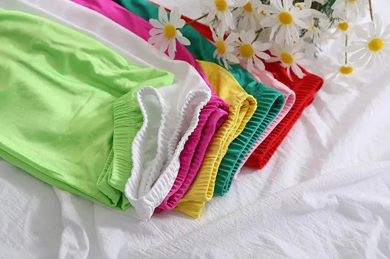 High-elastic skinny leggings by Simples Market in assorted bright colors; shiny, skin-friendly yoga pants for women