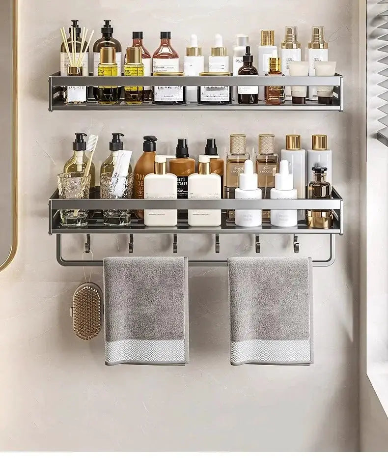 No-drill aluminum corner bathroom shelf by Simples Market; dual-tier shampoo organizer with towel bar, two gray towels.