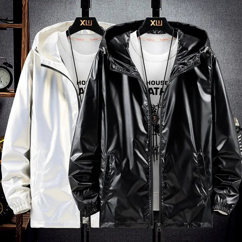 Pair of men's shiny hooded bomber jackets in black and white; lightweight, waterproof windbreaker coats