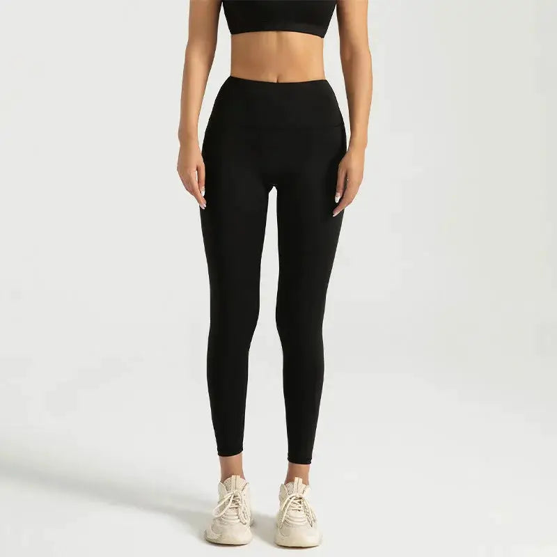 Black high-waisted women's yoga leggings with abdominal compression.