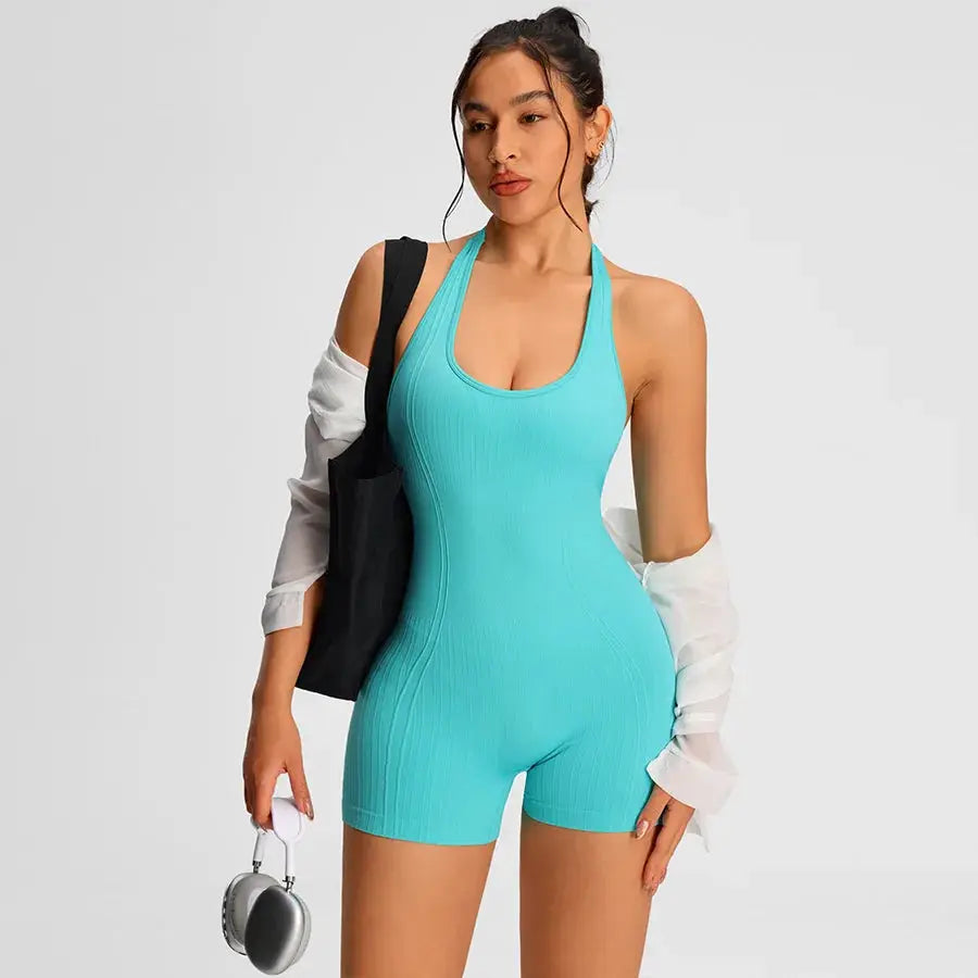 Turquoise ribbed halter-neck romper jumpsuit for women; fitted gym/activewear with shorts.