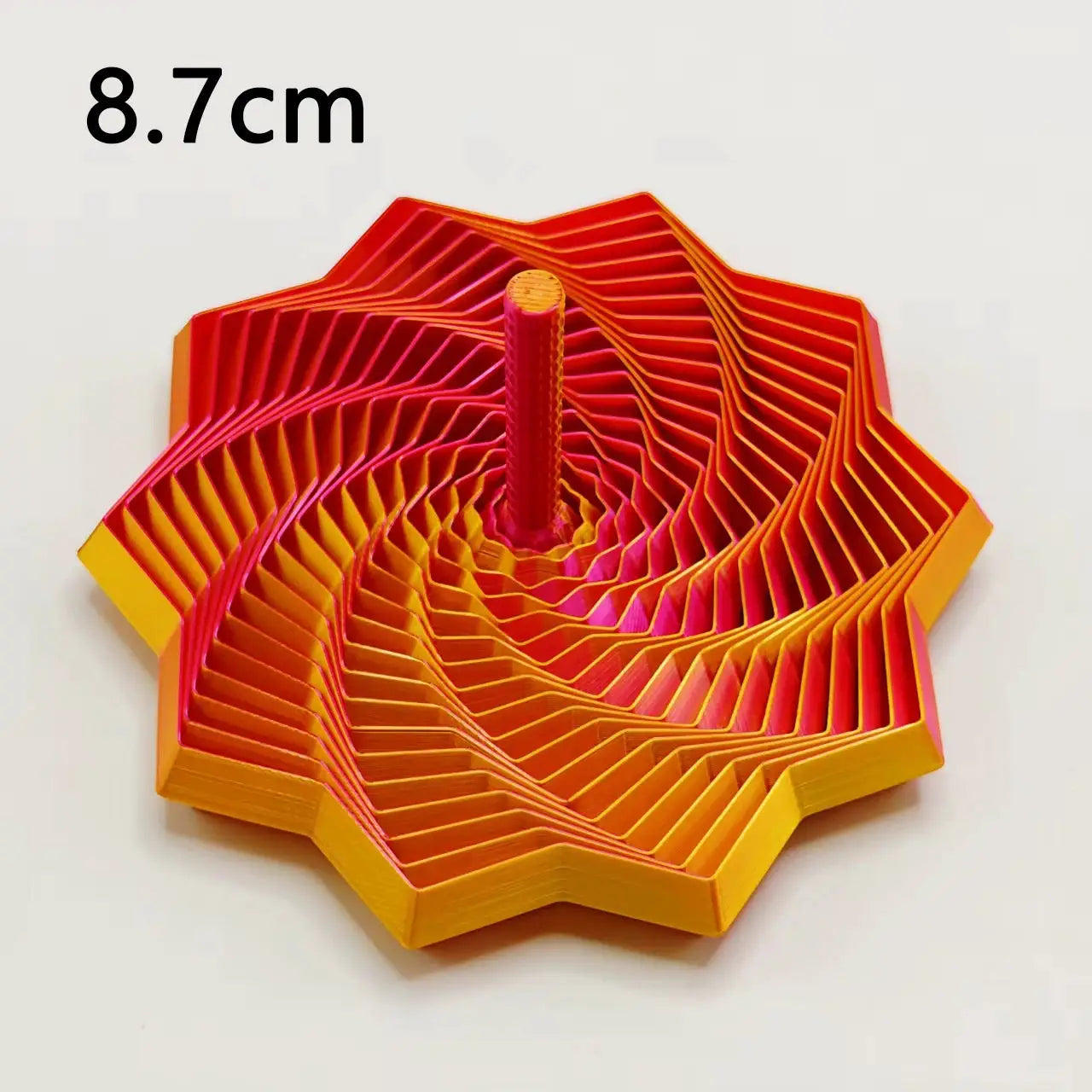 3D-printed sensory fidget star with expanding orange-to-pink spiral hexagon design