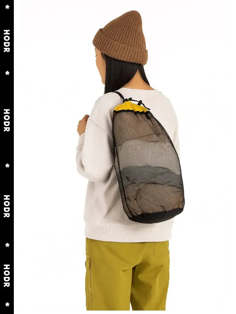 Mesh bag by HODR; drawstring stuff sack in lightweight black mesh with yellow top closure for camping gear