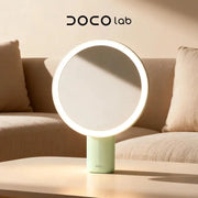 DOCO lab LED makeup mirror with circular LED ring, mint green base, 8-inch tabletop design.