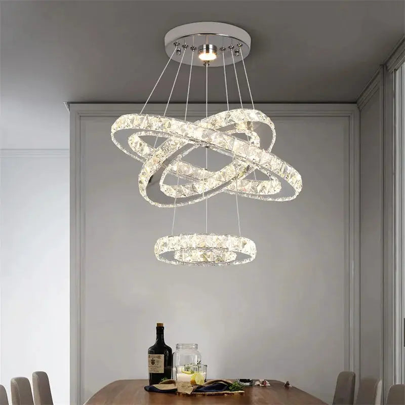 Modern crystal ring chandelier by Simples Market, chrome finish, four interlocking LED rings