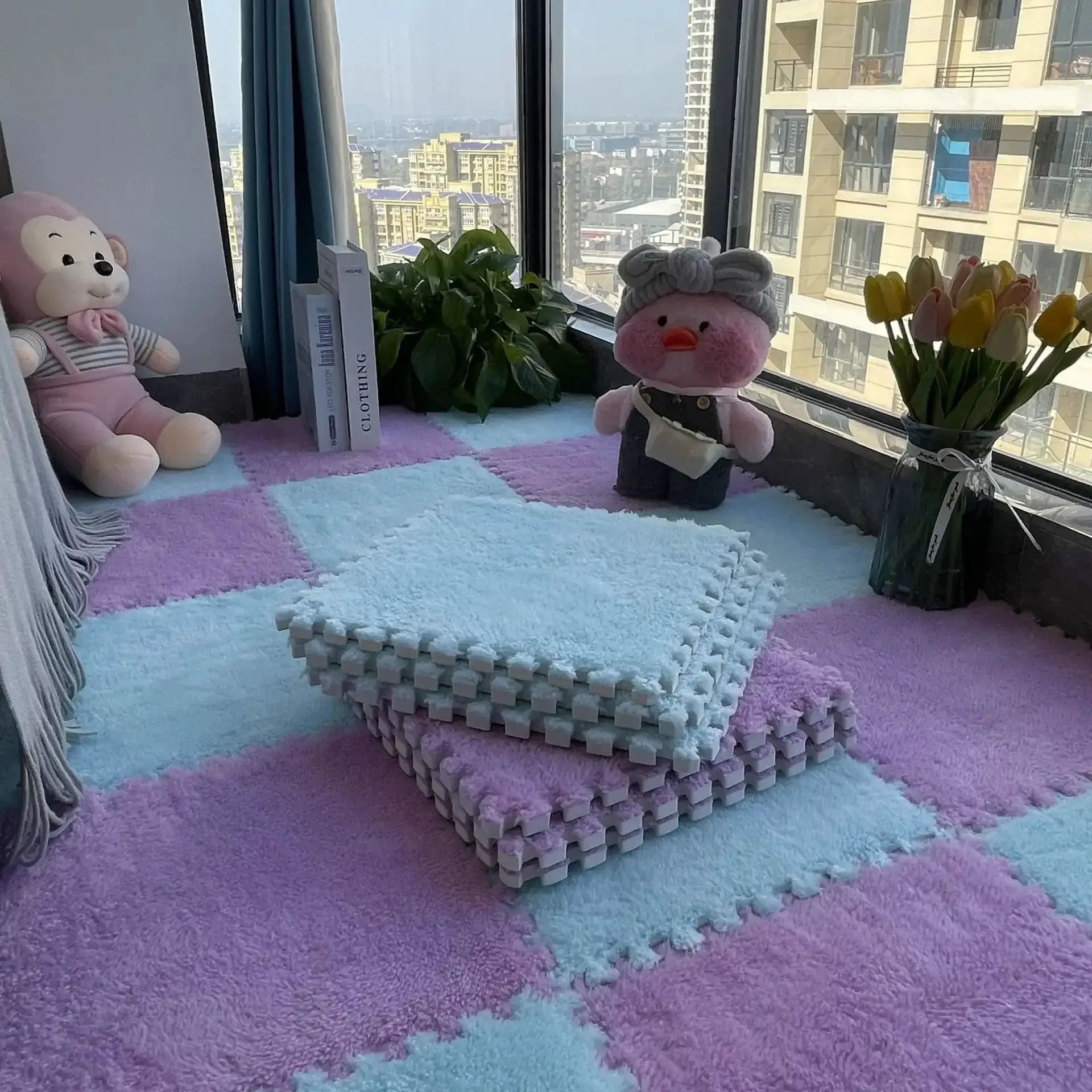 Soft plush EVA foam puzzle play mat in pastel blue and pink, interlocking 30cm tiles by Simples Market