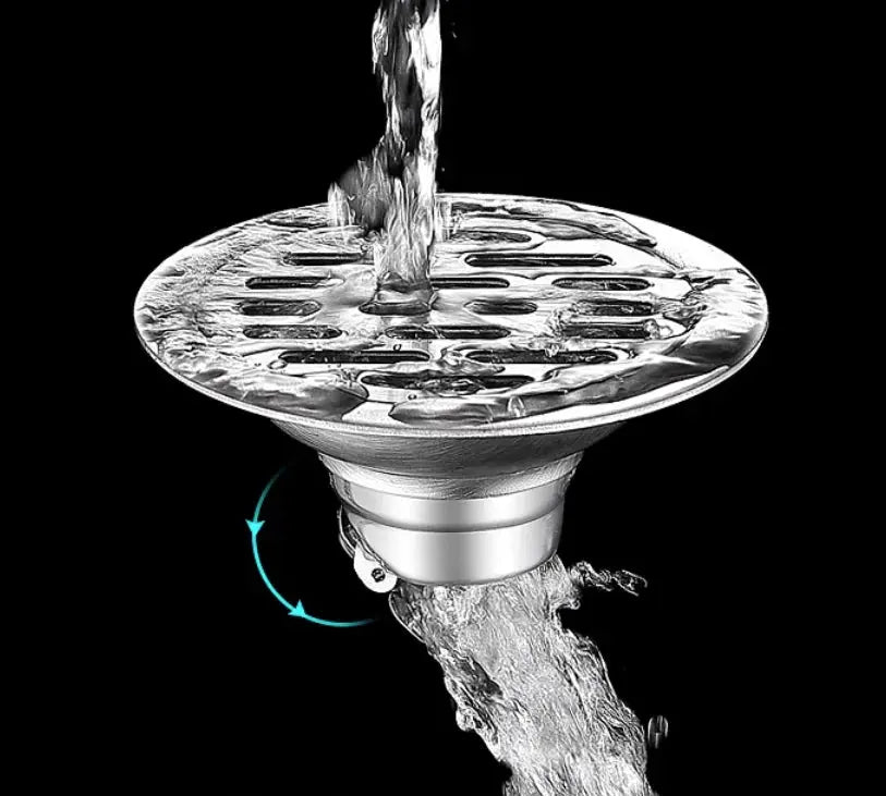 Stainless steel floor drain with hair catcher, chrome finish, water flowing through perforated top.