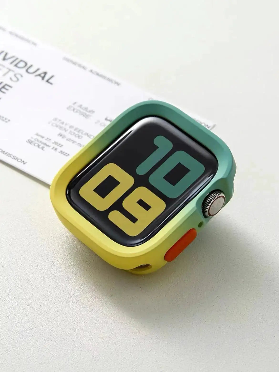 Simples Market Apple Watch bumper silicone case in green–yellow–orange gradient with orange button for 40–45mm models