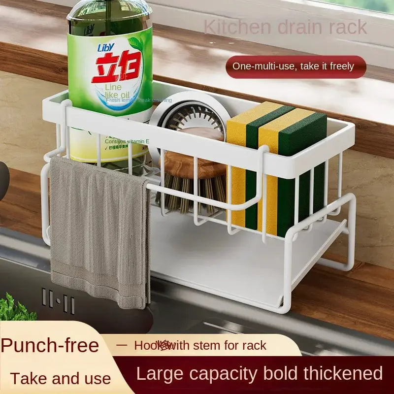 White two-tier kitchen drain rack over sink with sponge, brush and towel bar