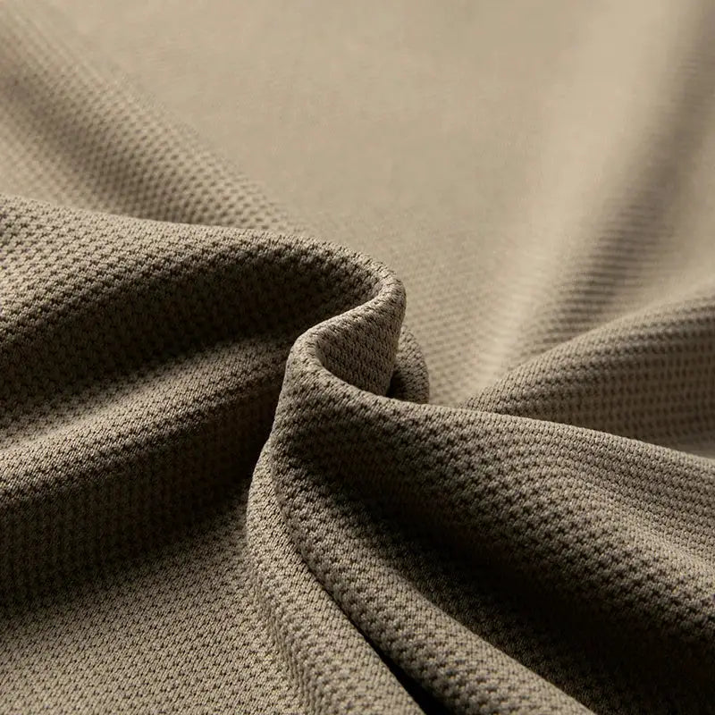 Men's polo shirt fabric close-up in tan brown knit texture