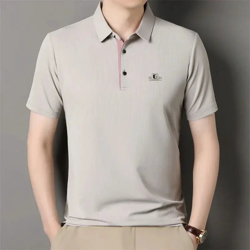 Simples Market men's grey polo shirt with small badge logo and short sleeves.