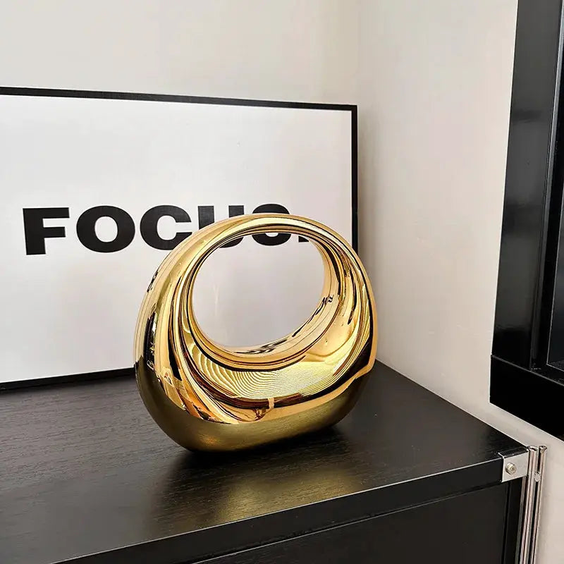 MOODS Golden Evening handbag with circular loop handle, gold PVC wrist clutch