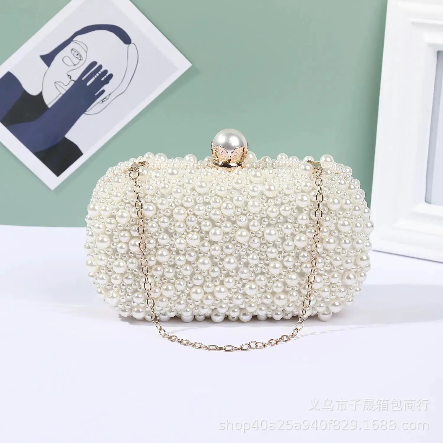 Pearl evening bag by Simples Market with pearl bead exterior, gold chain strap, round clasp.