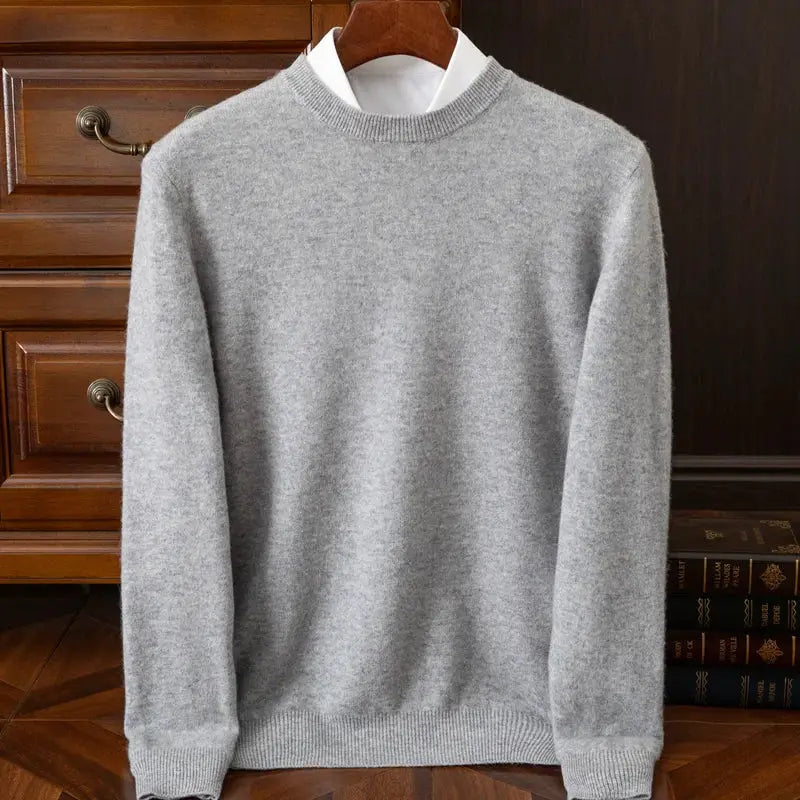 Men's gray cashmere crew-neck sweater with ribbed cuffs and hem, oversized fit.