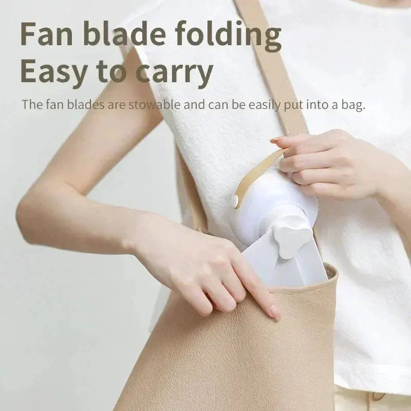 Portable foldable USB handheld fan with beige carry bag