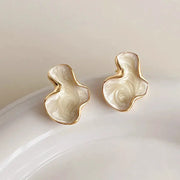 Simples Market pair of cloud-shaped stud earrings, white marbled with pink swirls, gold trim