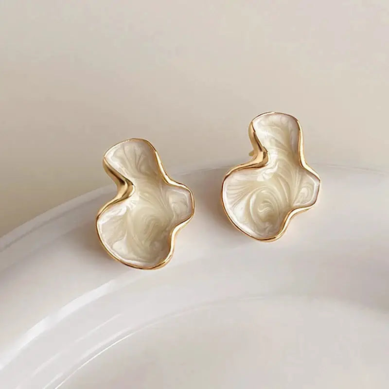 Simples Market pair of cloud-shaped stud earrings, white marbled with pink swirls, gold trim