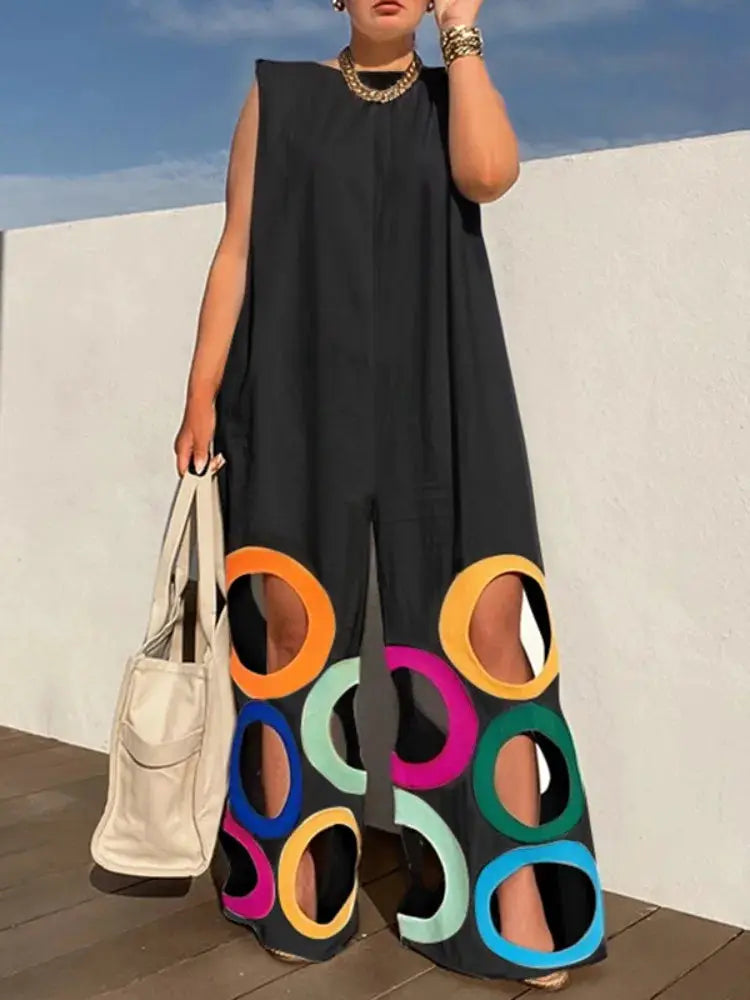 Yeezzi jumpsuit, black sleeveless wide-leg with colorful circular cutouts at the hem