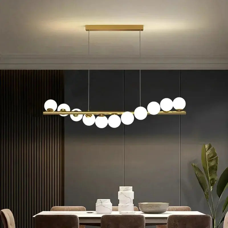 Nordic ceiling chandelier by Simples Market; gold bar with white globe lights for living room or dining area.