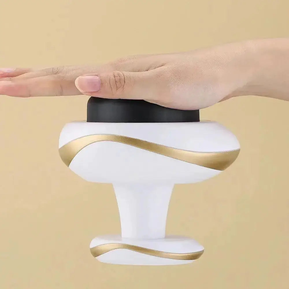 Simples Market electric cupping massage device, handheld with white body and gold trim, black top