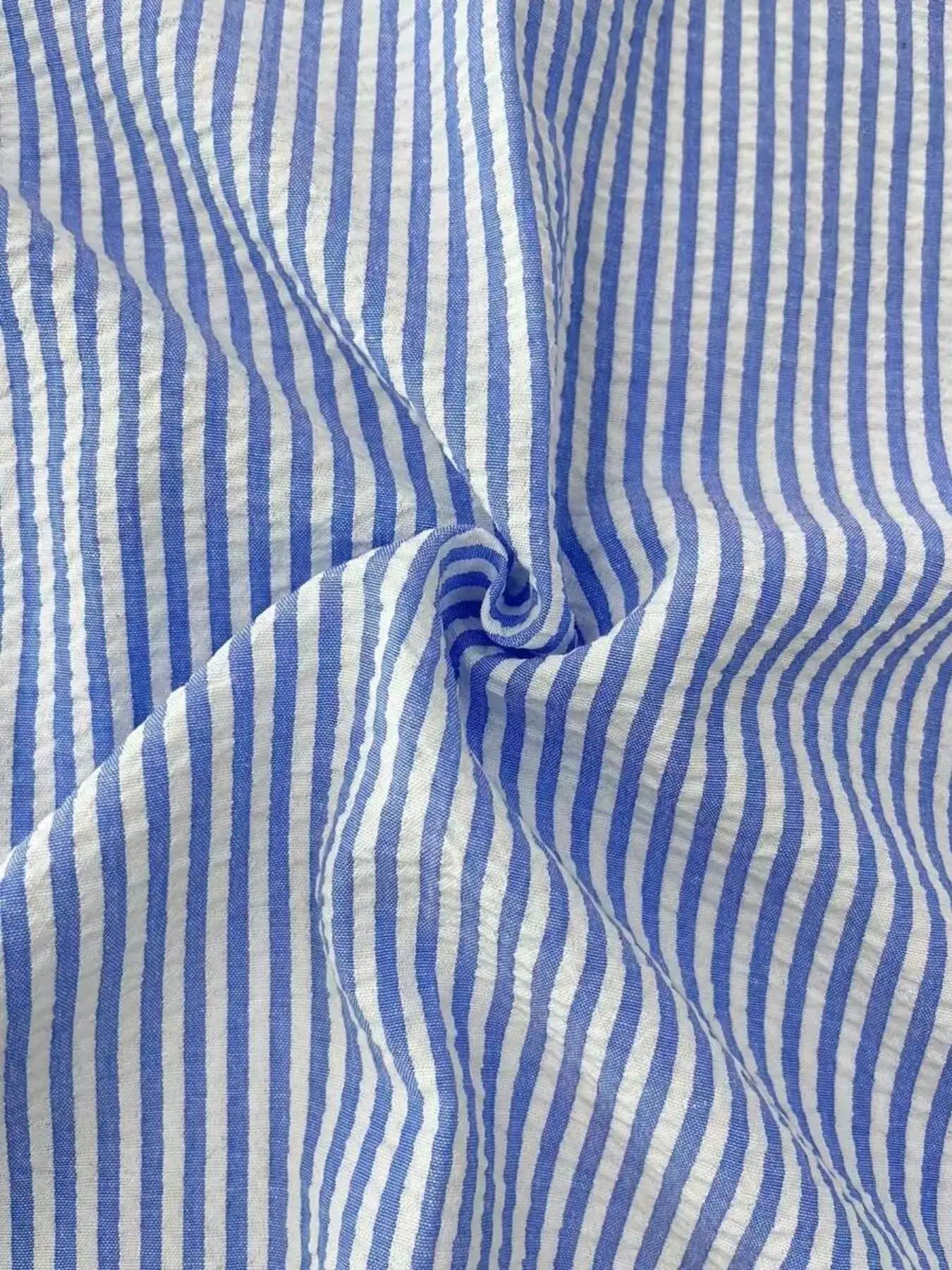 Men's blue and white striped long-sleeve shirt, casual loose-fit fabric close-up