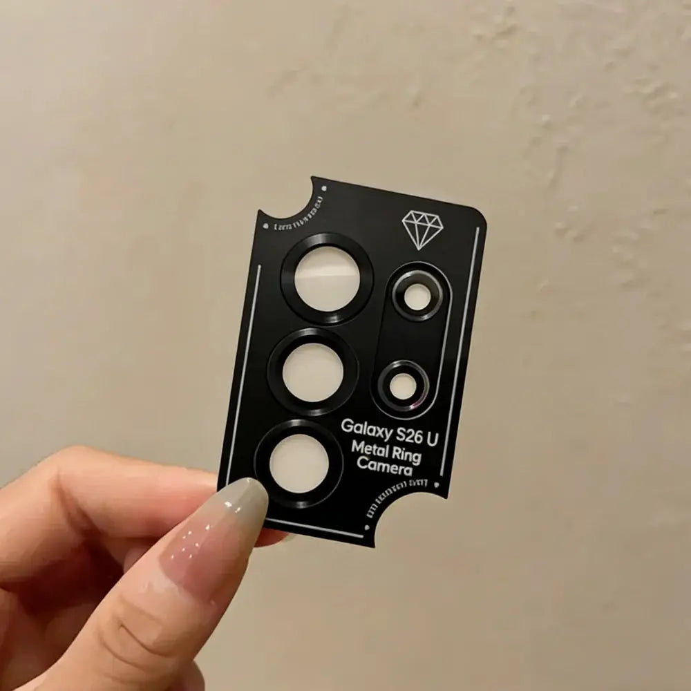 Camera lens ring metal case in black with circular cutouts for Galaxy S26 Ultra, shown on a black card with logo