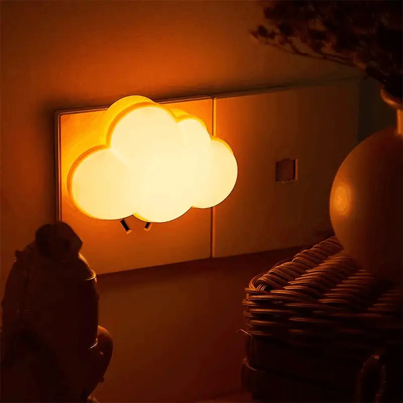 LED cloud-shaped night light by Simples Market, plug-in motion sensor with warm orange glow
