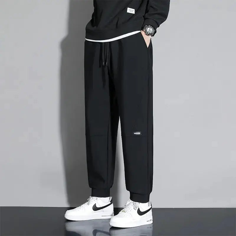 Men's casual black jogger pants 10XL by Simples Market, elastic waist with drawstring, quick-dry fabric, oversized fit.