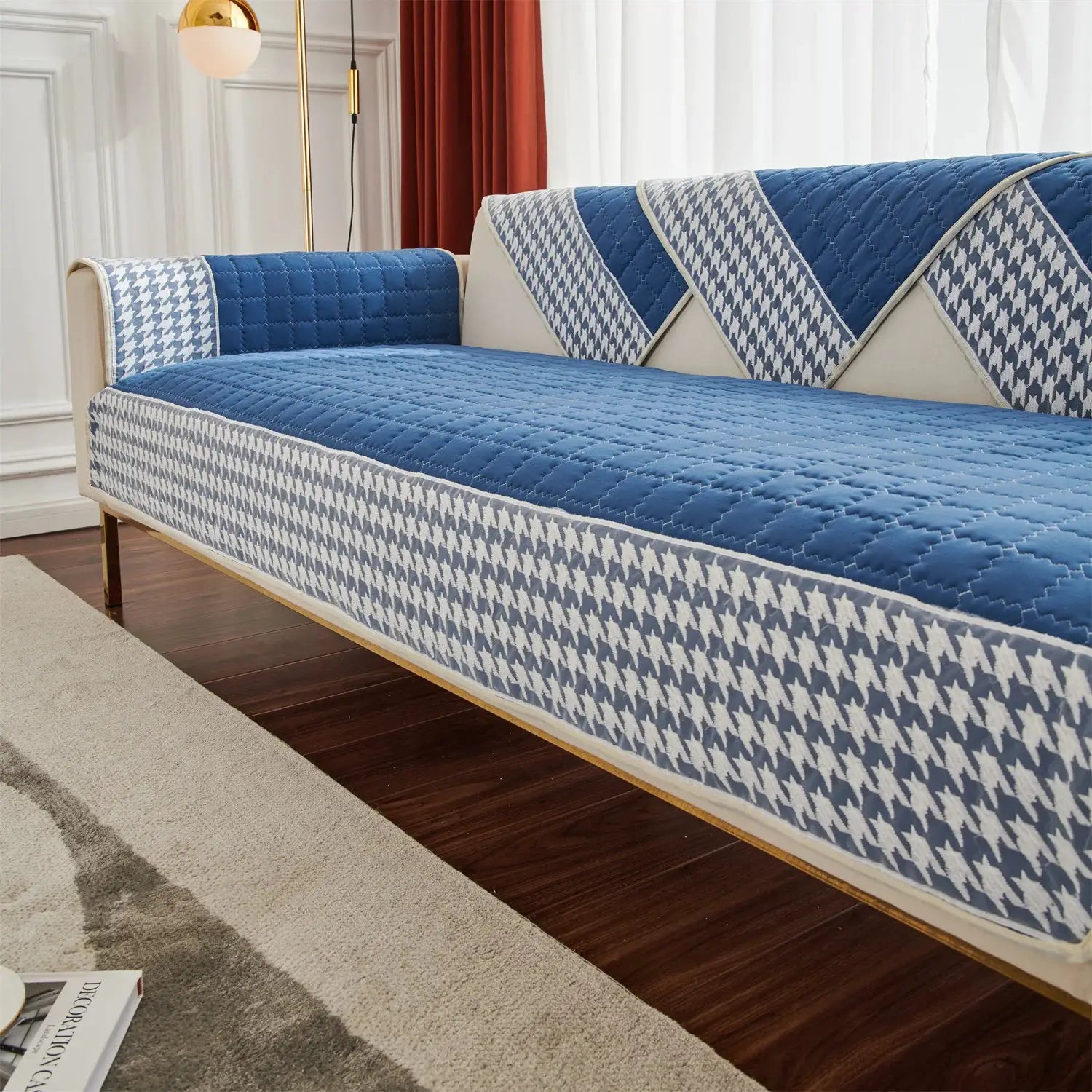 Sofa slipcover by Simples Market in blue and white houndstooth quilted fabric with anti-slip backing