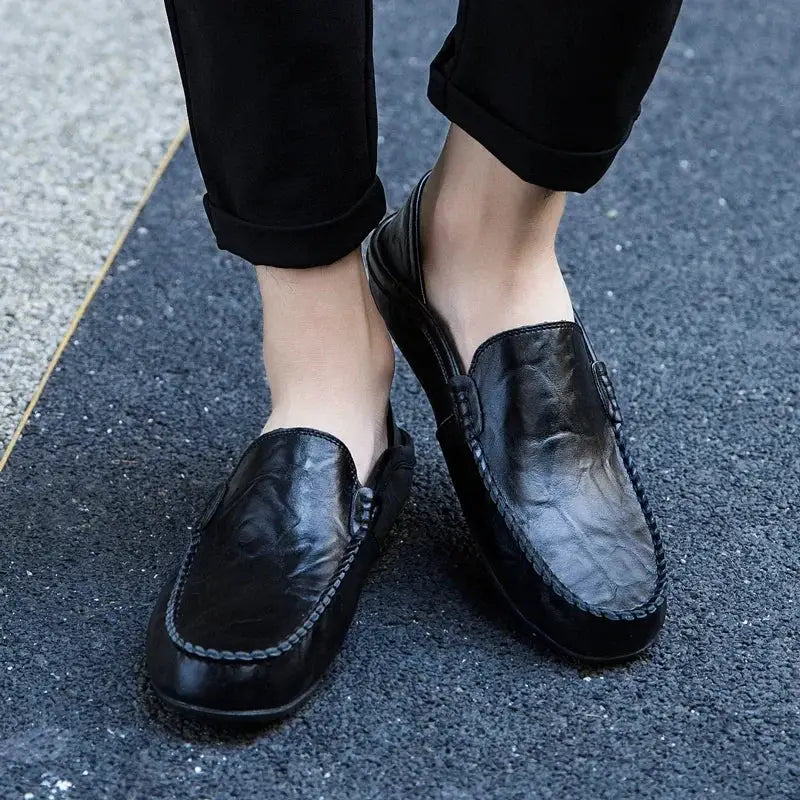 Men's black genuine leather loafers, casual slip-on style; pair shown