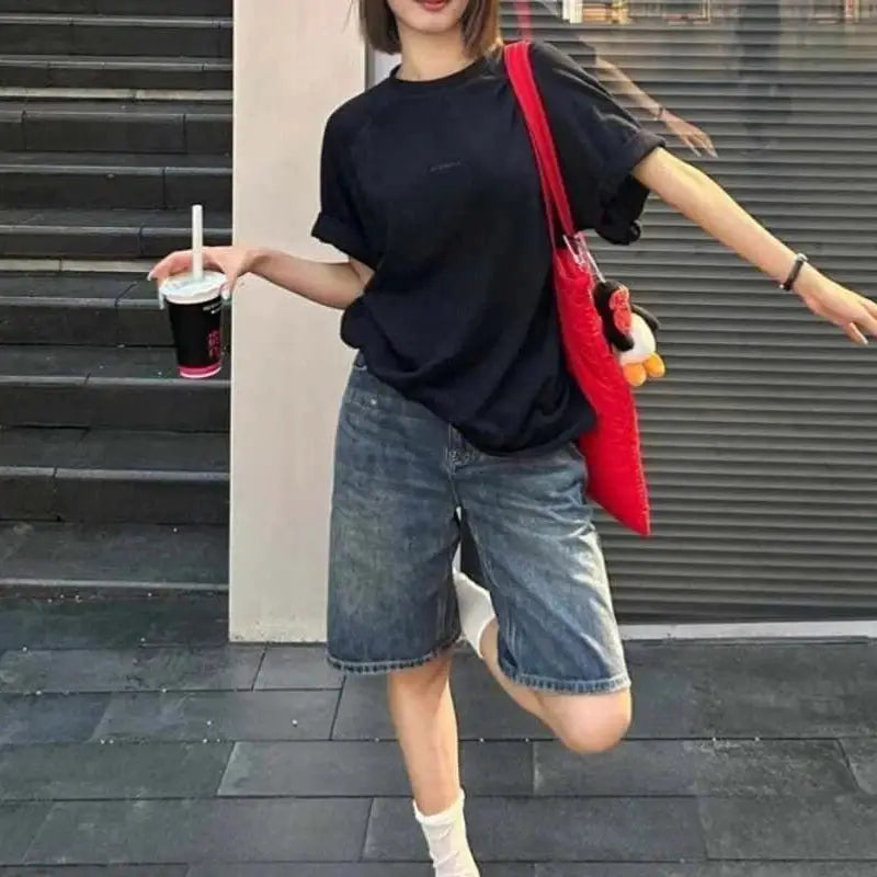 Women's blue knee-length high-waisted wide-leg denim shorts for casual summer wear.