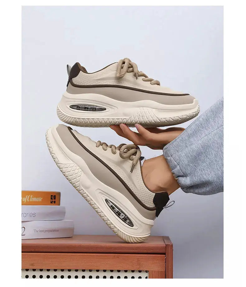 Pair of men's casual sports shoes in cream with beige-brown trim and thick air-cushion sole