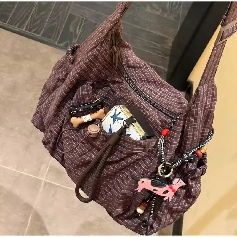 Korean nylon plaid maroon shoulder bag by Simples Market with zipper, drawstring closure and front pocket