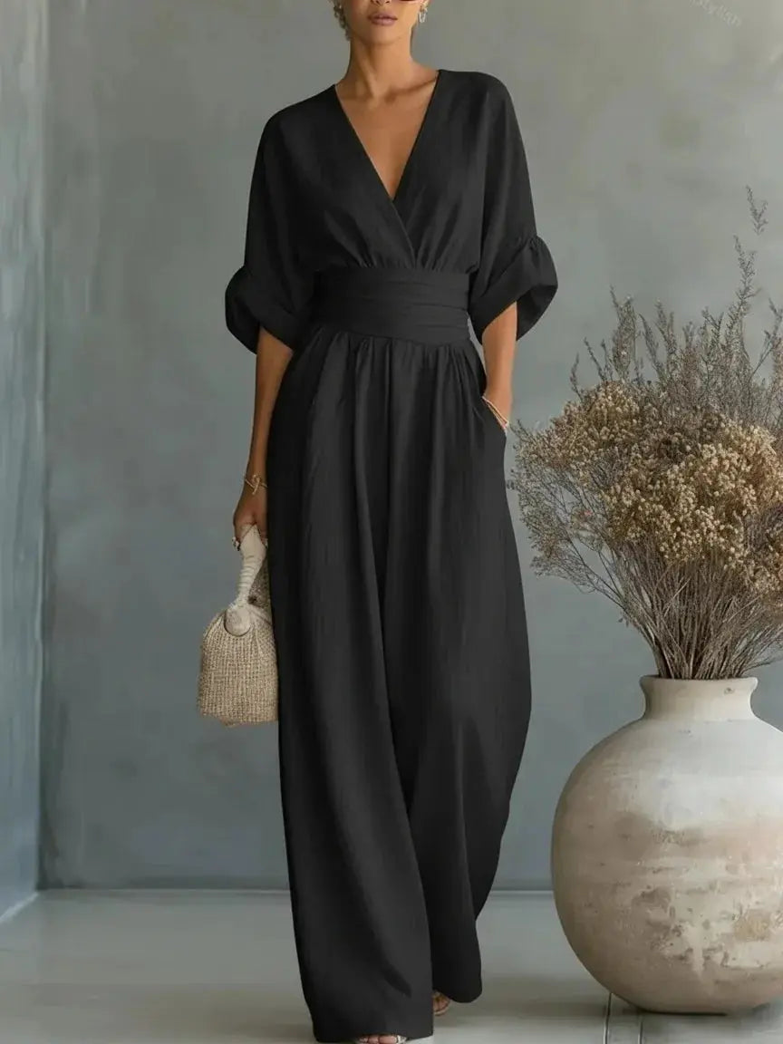 Waist V-neck Jumpsuit in black with a wide-leg silhouette and mid-sleeve design by Simples Market.